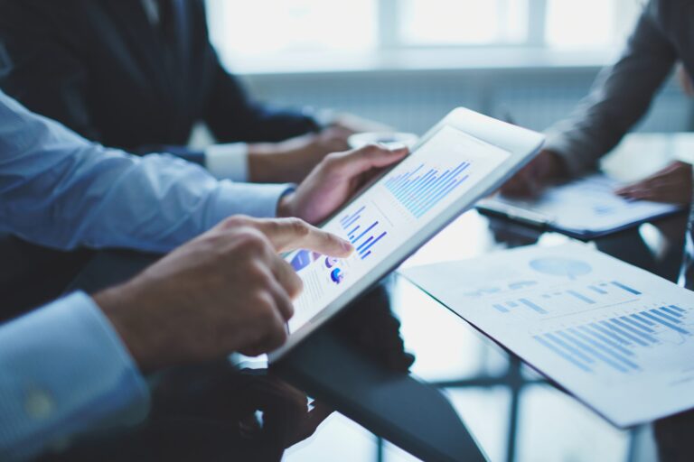 close-up-businessman-with-digital-tablet-scaled-1